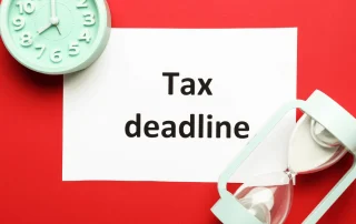 Text says Tax Deadline with clock and hourglass